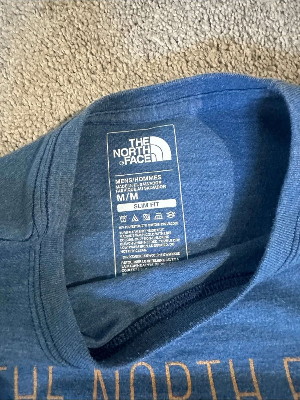The North Face Men’s Blue Short Sleeve Graphic Tee with Pink Accent